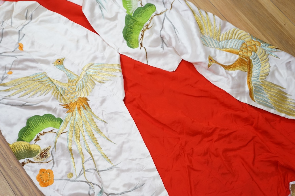 A late 20th century polychrome silk and metallic embroidered Japanese kimono, 133cm long. Condition - the silk is stained in places, which may be able to be cleaned.